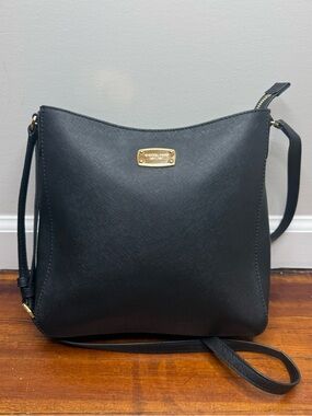 Michael Kors medium crossbody handbag features gold-toned